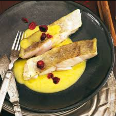 Tender fish fillet served with a light golden saffron sauce