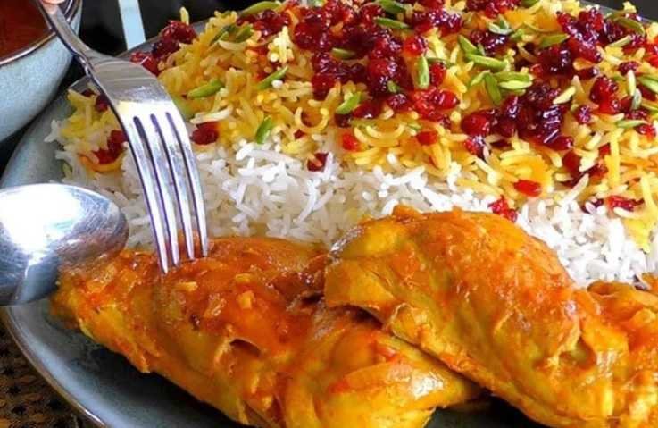 Golden saffron rice served with tender chicken pieces