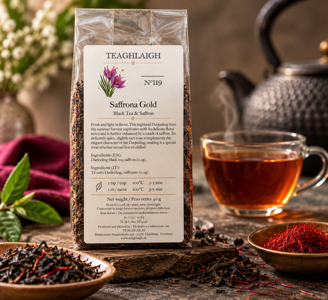 Saffrona Golden – Darjeeling Black Tea with Afghan Saffron Saffrona Golden Darjeeling with saffron: 40 g pack beside a cup of tea and saffron threads